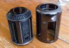 The new Mac Pro with its case removed, side by side with said case.