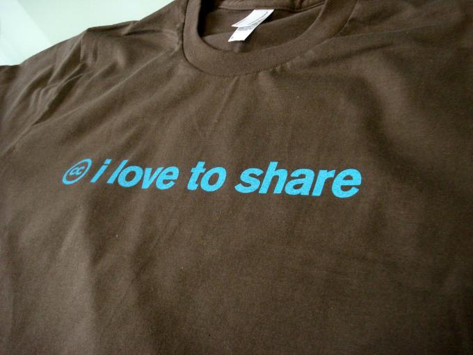 T Shirt with I love to share on it.