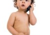 Baby with telephone, isolated on a white background.