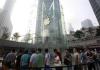 People queue up to buy the new iPad during its China launch at the Apple store in Shanghai