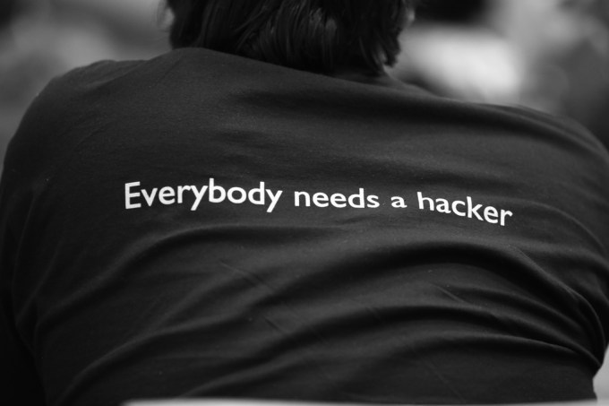 Back of T-shirt which reads, "Everybody needs a hacker."