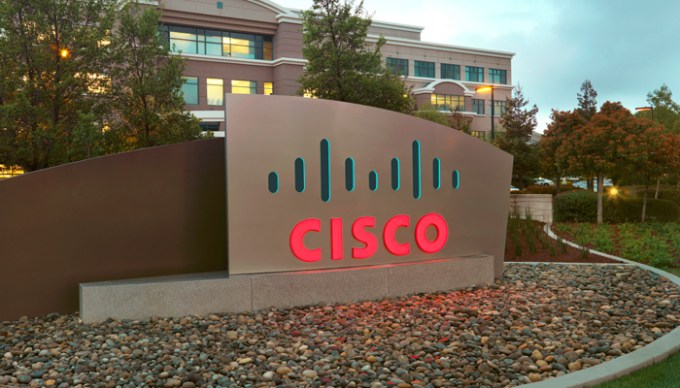 Cisco sign in front of Cisco headquarters.