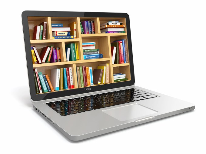 Laptop with bookshelf on screen to symbolized e learning.