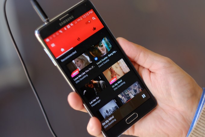 This photo shows the YouTube Music app on a mobile phone on Friday, Nov. 13, 2015, in Los Angeles. If you were going to reinvent MTV for a mobile generation, youd probably come up with something like YouTube Music. Its a video-first music service that also plays in the background like you'd expect a music app to do. (AP Photo/Richard Vogel)