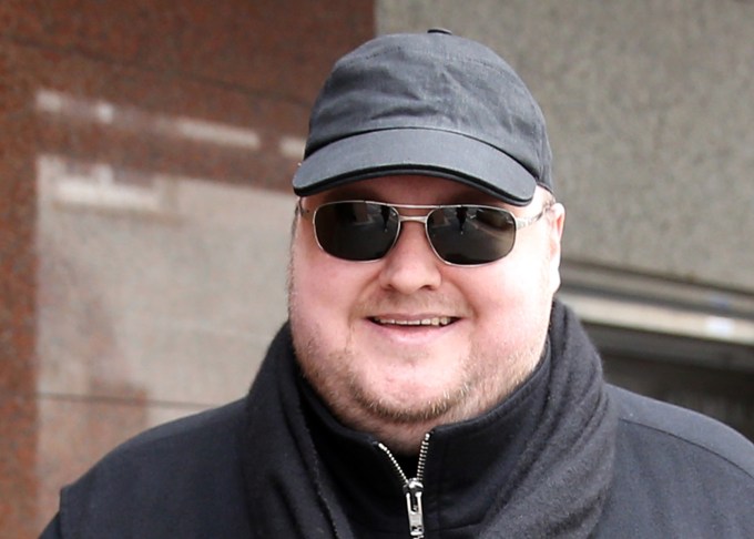 Megaupload founder Kim Dotcom, 41, leaves court for lunch in Auckland on September 21, 2015, as he fights a US bid to extradite him from New Zealand. Dotcom's long-awaited extradition hearing opened in New Zealand on September 21 with the Internet mogul confident he can avoid being sent to the United States to face online piracy charges. The 41-year-old and his three co-accused -- ex-Megaupload executives Finn Batato, Mathias Ortmann, and Bram van der Kolk -- face jail terms of up to 20 years if convicted in the US.  AFP PHOTO / Michael Bradley        (Photo credit should read MICHAEL BRADLEY/AFP/Getty Images)