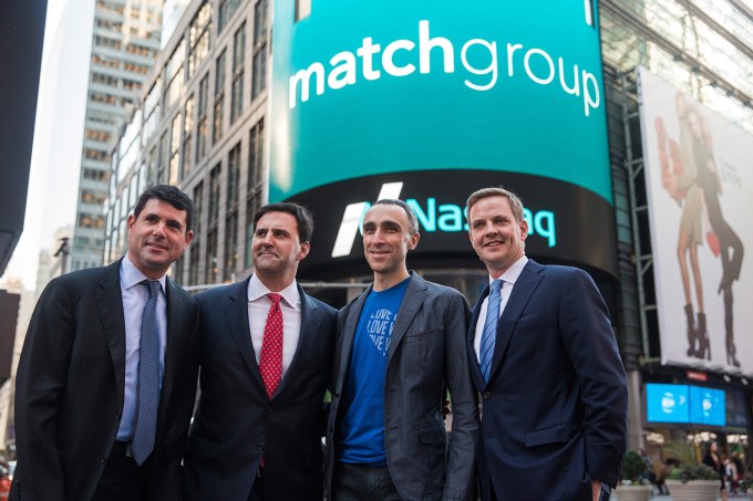 NEW YORK, NY - NOVEMBER 20:  (L-R) Gary Swidler, chief financial officer of Match Group, Greg Blatt, chairman of Match Group, Sam Yagan, CEO of Match Group and co-founder and CEO of OkCupid and Nelson Griggs, vice president of Nasdaq, pose for a photo in Times Square after celebrating Match Group's initial public offering (IPO) at the NASDAQ stock exchange on November 20, 2015 in New York City. The company began trading on the NASDAQ yesterday morning with an IPO of $12 per share.  (Photo by Andrew Burton/Getty Images)