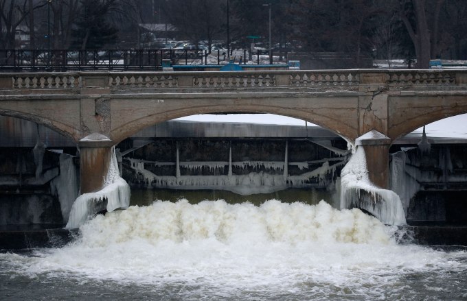 The Flint River is shown near downtown Flint, Mich., Thursday, Jan. 21, 2016.  Residents in the former auto-making hub  a poor, largely minority city  feel their complaints about lead-tainted water flowing through their taps have been slighted by the government or ignored altogether. For many, it echoes the lackluster federal response to New Orleans during Hurricane Katrina in 2005. (AP Photo/Paul Sancya)