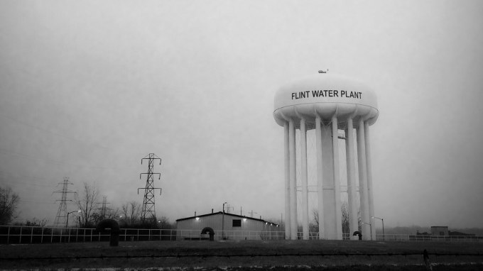 This Jan. 21, 2016 photo shows the water tower at the Flint, Mich., water plant. Flints mayor has floated a shockingly high price to fix the citys lead-contamination problem, saying it could millions to replace damaged pipes. (Perry Rech/American Red Cross via AP) MANDATORY CREDIT
