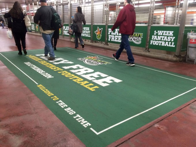 In this photo taken on Tuesday, Dec. 1, 2015, an ad for daily fantasy sports operator DraftKings is displayed in a subway station in Philadelphia. A state judge has barred daily fantasy sports sites DraftKings and FanDuel from doing business in New York.  The order issued Friday, Dec. 11, 2015, by state Supreme Court Justice Manuel Mendez also denied the country's two biggest daily fantasy sports sites' attempts to block the state's attorney general enforcement action. (AP Photo/Oskar Garcia)