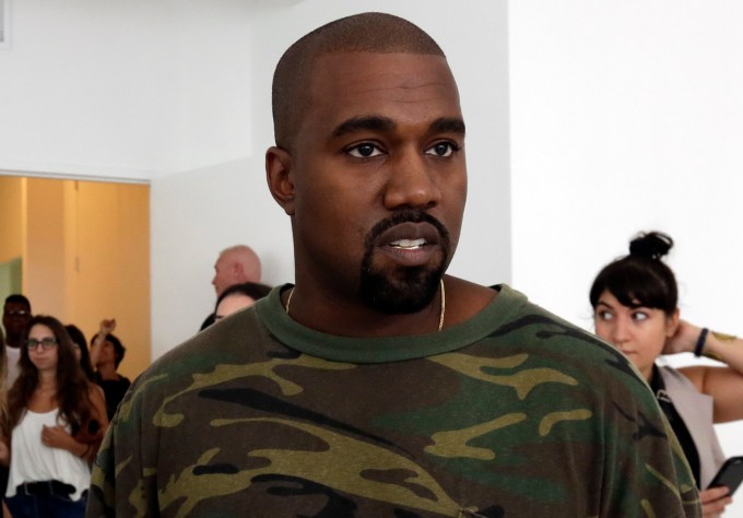 FILE - In this Sept. 10, 2015 file photo, Kanye West appears at the Brother Vellies Spring 2016 collection presentation during Fashion Week, in New York. Wests presentation during New York Fashion Week, Wednesday, Sept. 16, showed off his baggy and rural collection in a militant style as Anna Wintour, Lorde and Kim Kardashian _ holding baby North West _ sat front row. West debuted Yeezy Season 2 on Wednesday at the Skylight Modern in New York. (AP Photo/Richard Drew, File)
