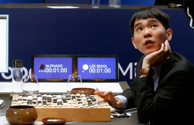 South Korean professional Go player Lee Sedol reviews the match after finishing the second match of the Google DeepMind Challenge Match against Google's artificial intelligence program, AlphaGo in Seoul, South Korea, Thursday, March 10, 2016. The human Go champion said he was left "speechless" after his second straight loss to Google's Go-playing machine on Thursday in a highly-anticipated human versus machine face-off. (AP Photo/Lee Jin-man)