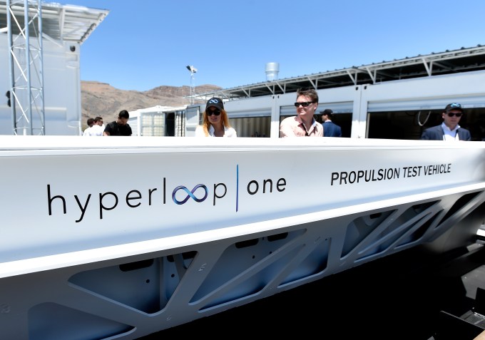 NORTH LAS VEGAS, NV - MAY 11:  People look at a demostration test sled after the first test of the propulsion system at the Hyperloop One Test and Safety site on May 11, 2016 in North Las Vegas, Nevada. The company plans to create a fully operational hyperloop system by 2020.  (Photo by David Becker/Getty Images)
