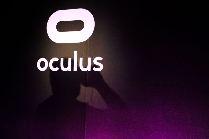 A shadow is cast on the Oculus sign, as a visitor uses Oculus goggles to experience Minecraft for Gear VR during a press demonstration, at The Village event space, in San Francisco, California on March 15, 2016. (Photo: GABRIELLE LURIE/AFP/Getty Images)