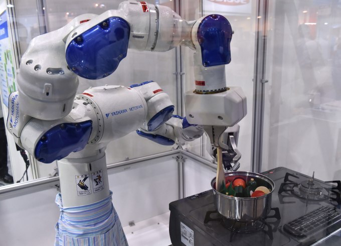 Japanese robot giant Yaskawa Electric's industrial robot Motoman performs a cooking demonstration at the International Food Machinery and Technology Exhibition in Tokyo on June 10, 2015. Some 680 Japanese and foreign food machinery companies are exhibiting their latest technology and products in the four-day trade show.           (Photo: YOSHIKAZU TSUNO/AFP/Getty Images)
