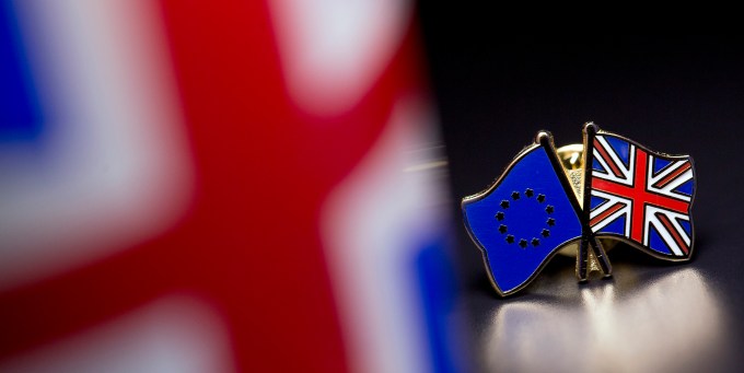LONDON, UNITED KINGDOM - MARCH 17: In this photo illustration, the European Union and the Union flag are pictured on a pin badge on March 17, 2016 in London, United Kingdom. The United Kingdom will hold a referendum on June 23, 2016 to decide whether or not to remain a member of the European Union (EU), an economic and political partnership involving 28 European countries which allows members to trade together in a single market and free movement across its borders for citizens. (Photo by Dan Kitwood/Getty Images)