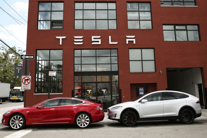 NEW YORK, NY - JULY 05:  Tesla vehicles sit parked outside of a new Tesla showroom and service center in Red Hook, Brooklyn on July 5, 2016 in New York City. The electric car company and its CEO and founder Elon Musk have come under increasing scrutiny following a crash of one of its electric cars while using the controversial autopilot service. Joshua Brown crashed and died in Florida on May 7 in a Tesla car that was operating on autopilot, which means that Brown's hands were not on the steering wheel.  (Photo by Spencer Platt/Getty Images)