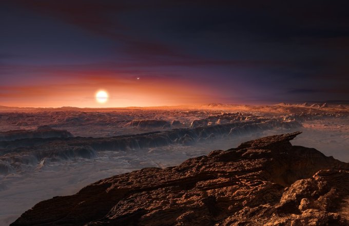 This artists impression shows a view of the surface of the planet Proxima b orbiting the red dwarf star Proxima Centauri, the closest star to the Solar System. The double star Alpha Centauri AB also appears in the image to the upper-right of Proxima itself. Proxima b is a little more massive than the Earth and orbits in the habitable zone around Proxima Centauri, where the temperature is suitable for liquid water to exist on its surface.
