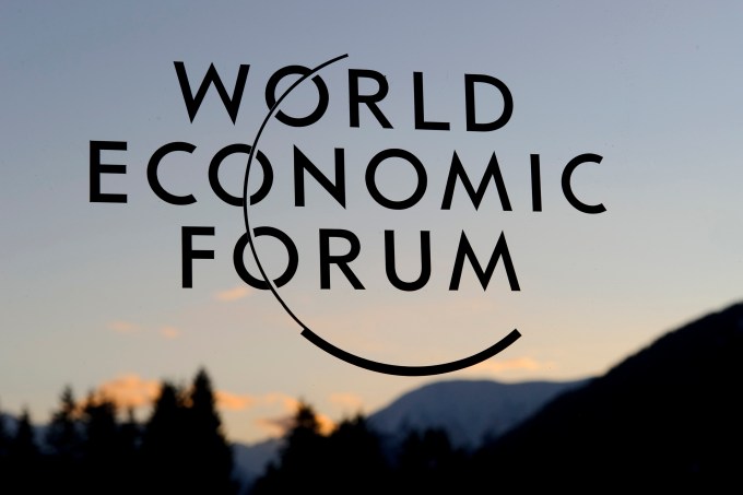 The logo of the World Economic Forum (WEF) is seen on the building of the Davos Congress center as the sun sets on January 29, 2011 in Davos. Some 2,500 political and industry leaders are gathered in the small alpine village for the forum, which ends on January 30. (Photo: FABRICE COFFRINI/AFP/Getty Images)