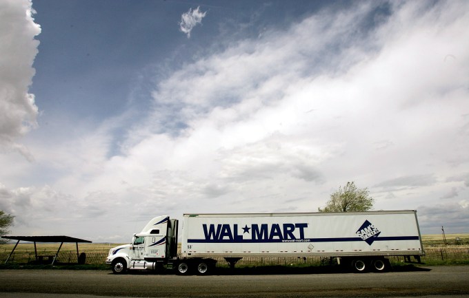 SPRINGER, NM -  MAY 15:  A Wal-Mart truck sits on the side of the highway May 15, 2005 near Springer, New Mexico.  Wal-Marts are now nearly ubiquitous on the American landscape, with over 3,000 stores coast-to-coast.  With growth, Wal-Mart continues to weather criticism of low wages, anti-union policies as well as accusations that it has homogenized America's retail economy and driven traditional stores and shops out of business. (Photo by Chris Hondros/Getty Images)