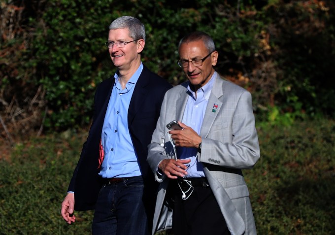 LOS ALTOS HILLS, CA - AUGUST 24:  Apple CEO Tim Cook (L) and Hillary Clinton campaign chairman John Podesta leave a fundraiser for Democratic presidential nominee former Secretary of State Hillary Clinton on August 24, 2016 in Los Altos Hills, California. Hillary Clinton is attending fundraisers in California.  (Photo by Justin Sullivan/Getty Images)