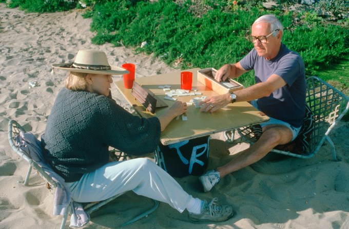 A retired couple playing a board game at Venice Beach, CA (Photo by Visions of America/UIG via Getty Images)