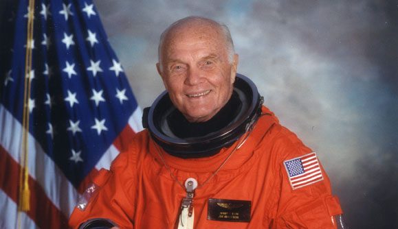 Color formal portrait of John Glenn in his spacesuit as a crew member on the Space Shuttle Discovery mission STS-95, 1998