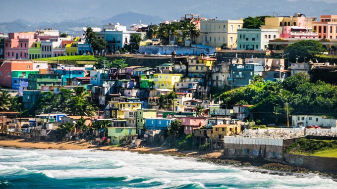 Bright, pastel colors of  houses in  a neighborhood of San Juan, Puerto Rico (Photo: KenWiedemann/iStock/Getty Images)