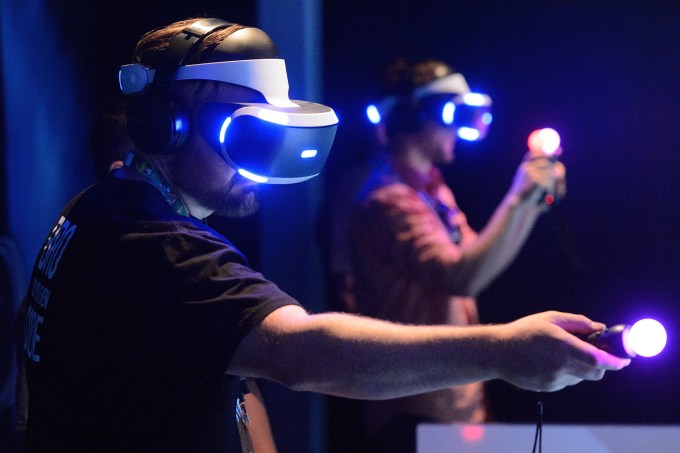 LOS ANGELES, CA - JUNE 15:  Attendees participate in VR virtual reality during E3 Electronic Entertainment Expo 2016 at Los Angeles Convention Center on June 14, 2016 in Los Angeles, California.  (Photo by Daniel Boczarski/WireImage)