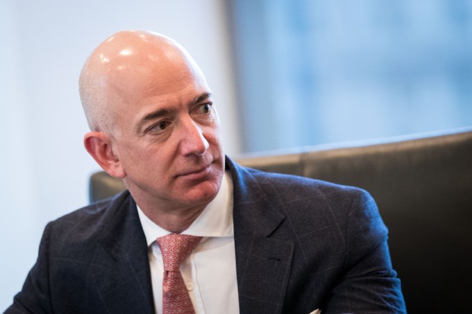 NEW YORK, NY - DECEMBER 14: Jeff Bezos, chief executive officer of Amazon, listens during a meeting of technology executives and President-elect Donald Trump at Trump Tower, December 14, 2016 in New York City. This is the first major meeting between President-elect Trump and technology industry leaders. (Photo by Drew Angerer/Getty Images)