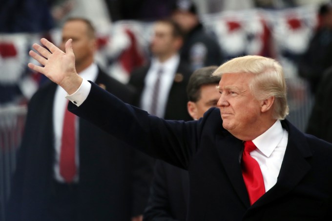 WASHINGTON, DC - JANUARY 20:  U.S. President Donald Trump waves to supporters as he walks the parade route during the Inaugural Parade on January 20, 2017 in Washington, DC. Donald J. Trump was sworn in today as the 45th president of the United States.  (Photo by Drew Angerer/Getty Images)