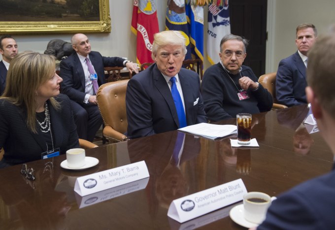 US President Donald Trump speaks alongside General Motors CEO Mary Barra (L) and Fiat Chrysler CEO Sergio Marchionne (2nd R) during a meeting withautomobile industry leaders in the Roosevelt Room of the White House in Washington, DC, January 24, 2017. / AFP / SAUL LOEB        (Photo credit should read SAUL LOEB/AFP/Getty Images)