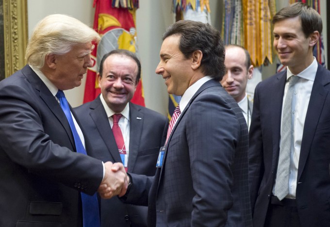 US President Donald Trump greets Ford President and CEO Mark Fields (C) prior to a meeting with automobile industry leaders in the Roosevelt Room of the White House in Washington, DC, January 24, 2017. / AFP / SAUL LOEB        (Photo credit should read SAUL LOEB/AFP/Getty Images)