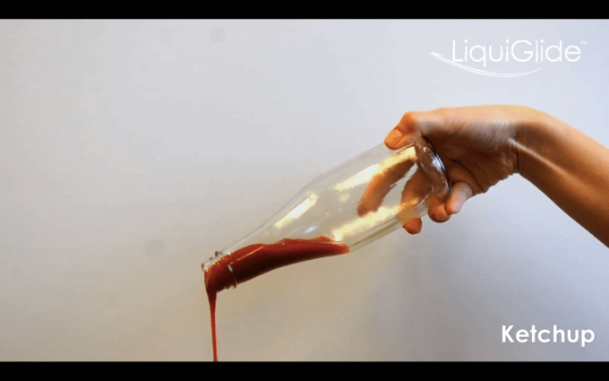 Ketchup falls freely out of a bottle featuring LiquiGlide's slippery coating.