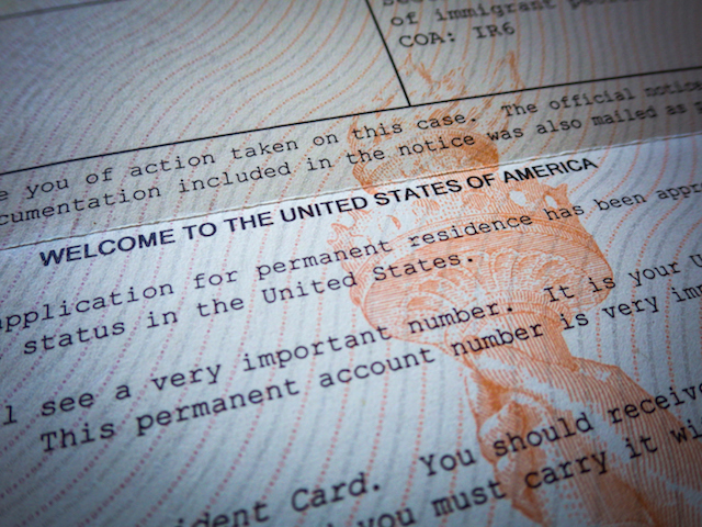 Detail of a Welcome to America Green Card acceptance letter for an immigrant.