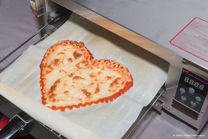 A heart-shaped pizza printed by BeeHex.