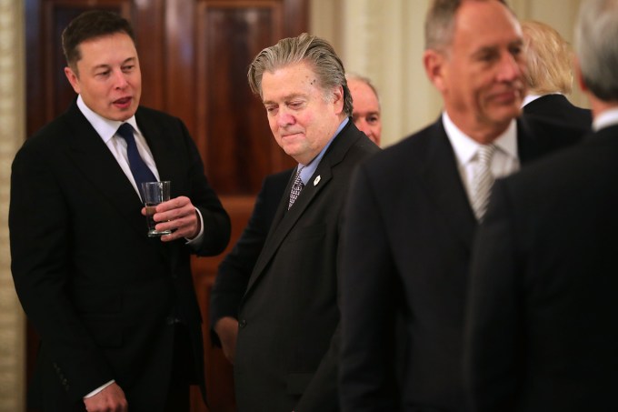 WASHINGTON, DC - FEBRUARY 03:  SpaceX and Tesla CEO Elon Musk (L) talks with White House Chief Strategist Steve Bannon at the beginning of a policy forum with U.S. President Donald Trump in the State Dining Room at the White House February 3, 2017 in Washington, DC. Leaders from the automotive and manufacturing industries, the financial and retail services and other powerful global businesses were invited to the meeting with Trump, his advisors and family.  (Photo by Chip Somodevilla/Getty Images)