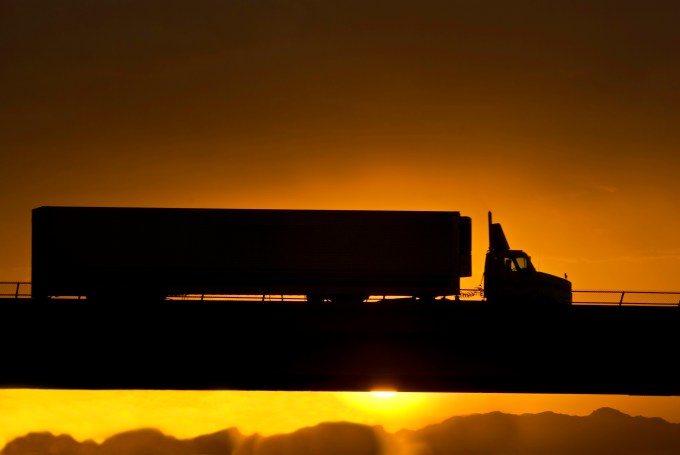 Semi-truck at sunset over I-10